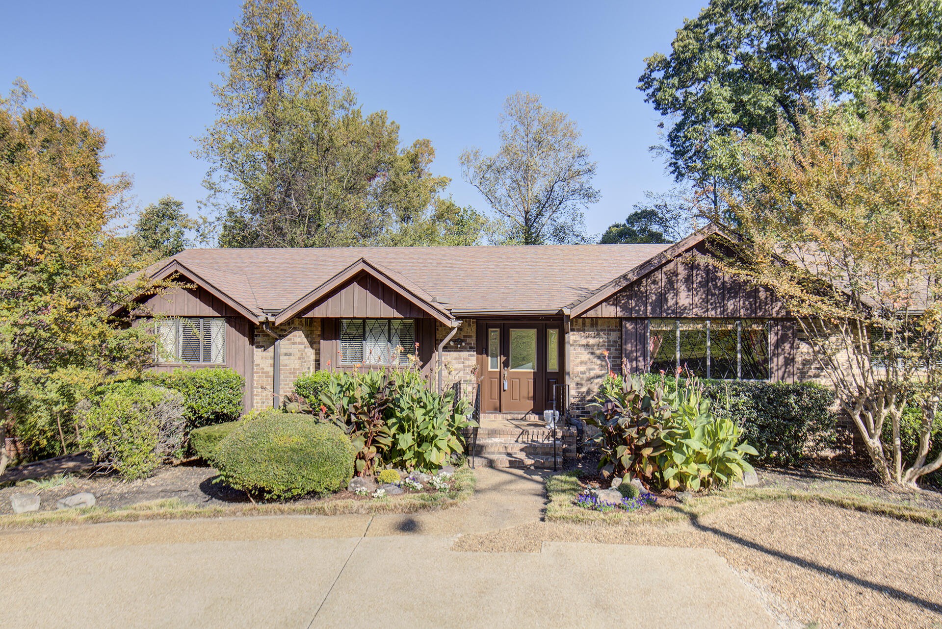 front view of a house with a bench