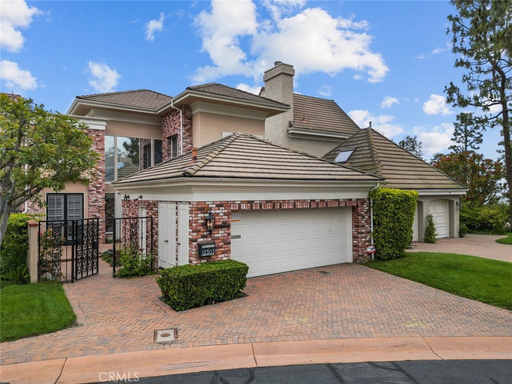 a front view of a house with garage