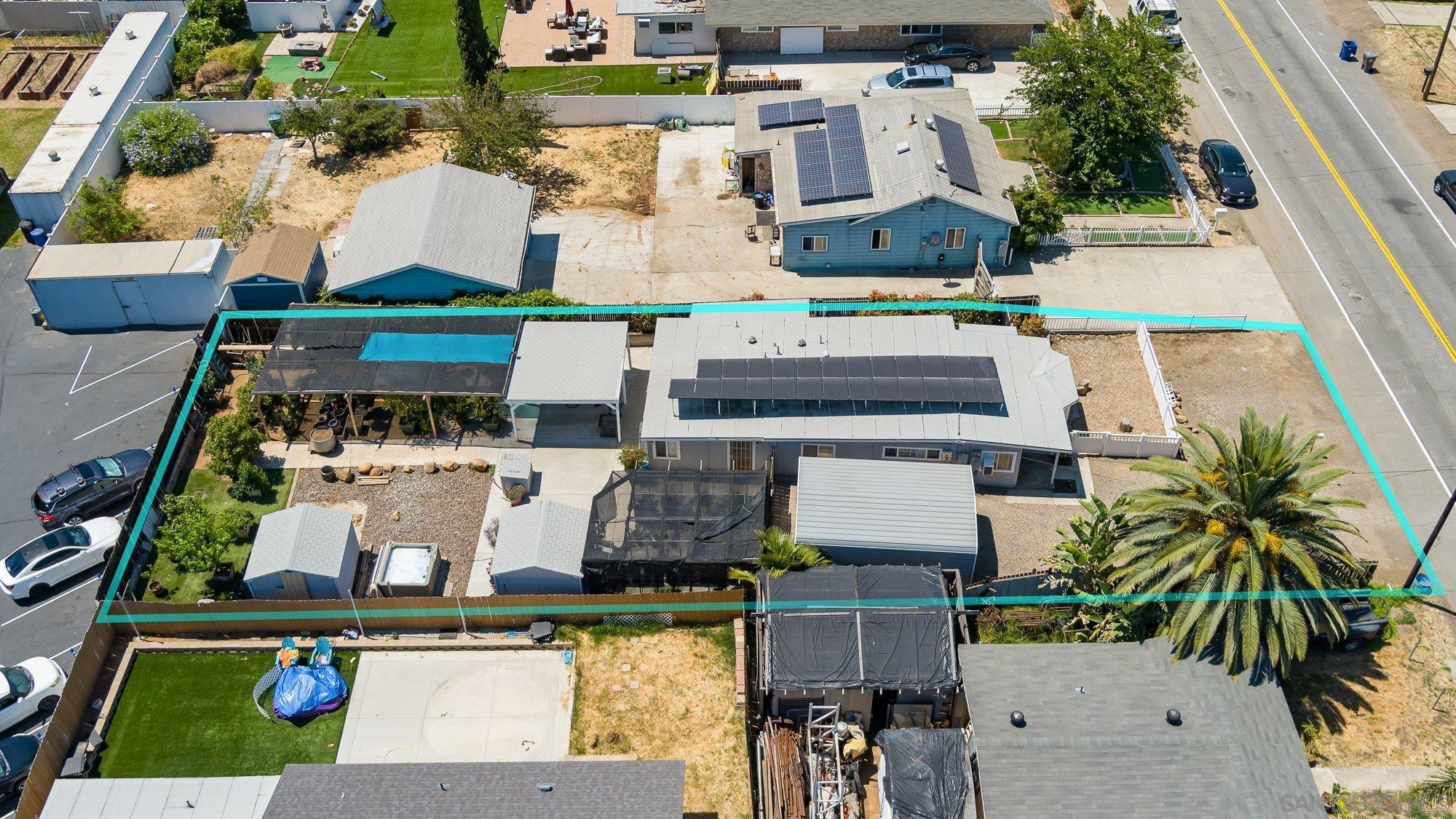 an aerial view of house with yard