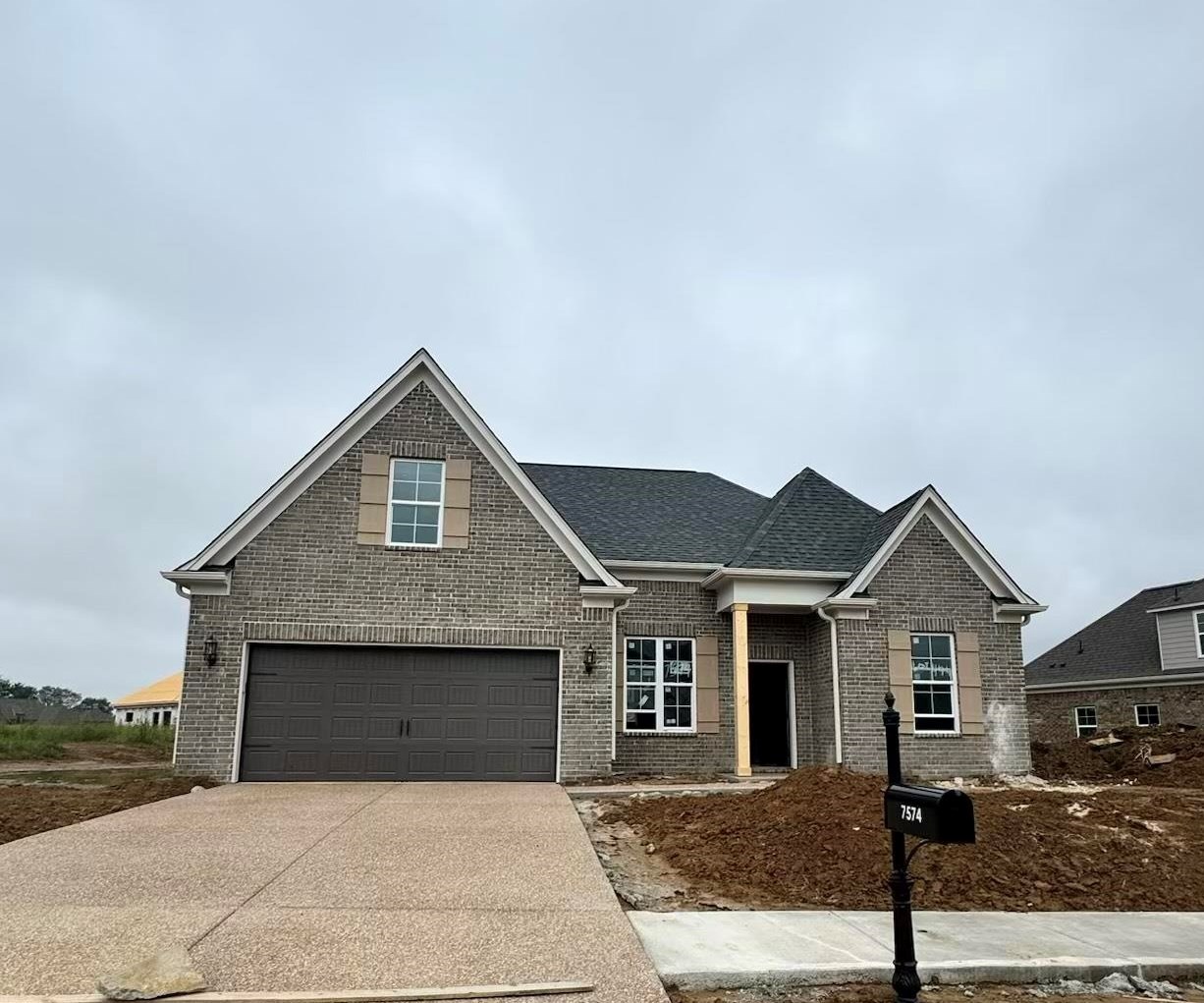 a front view of a house with yard