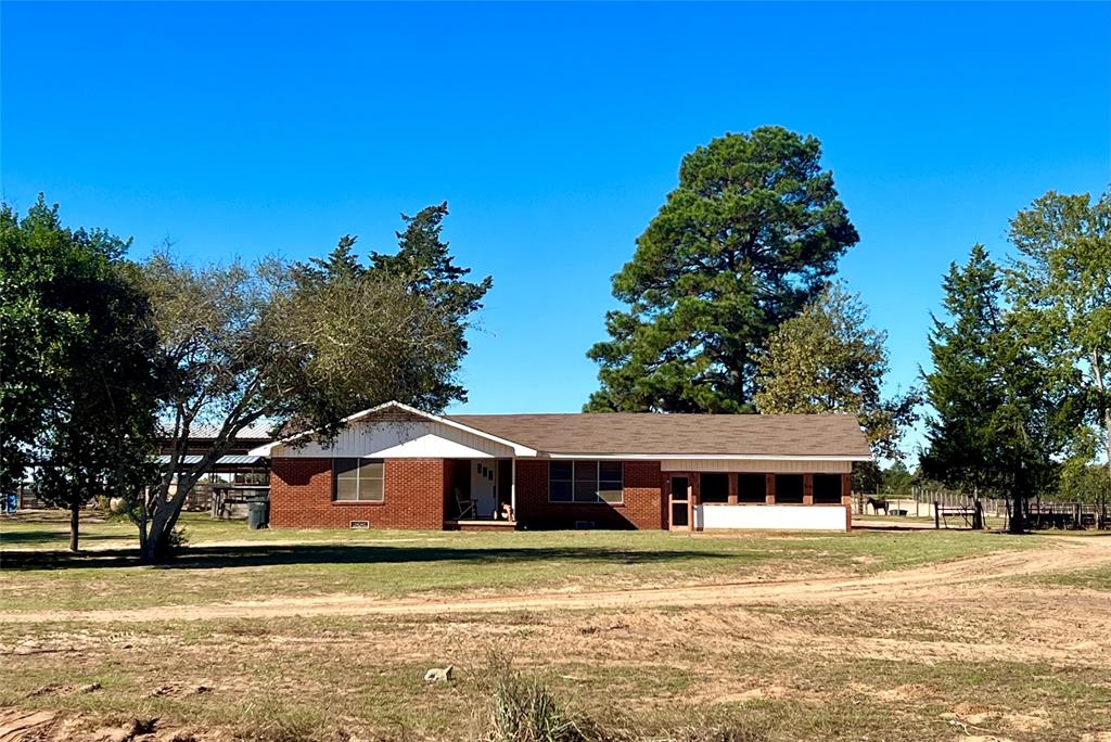 a house with trees in the background