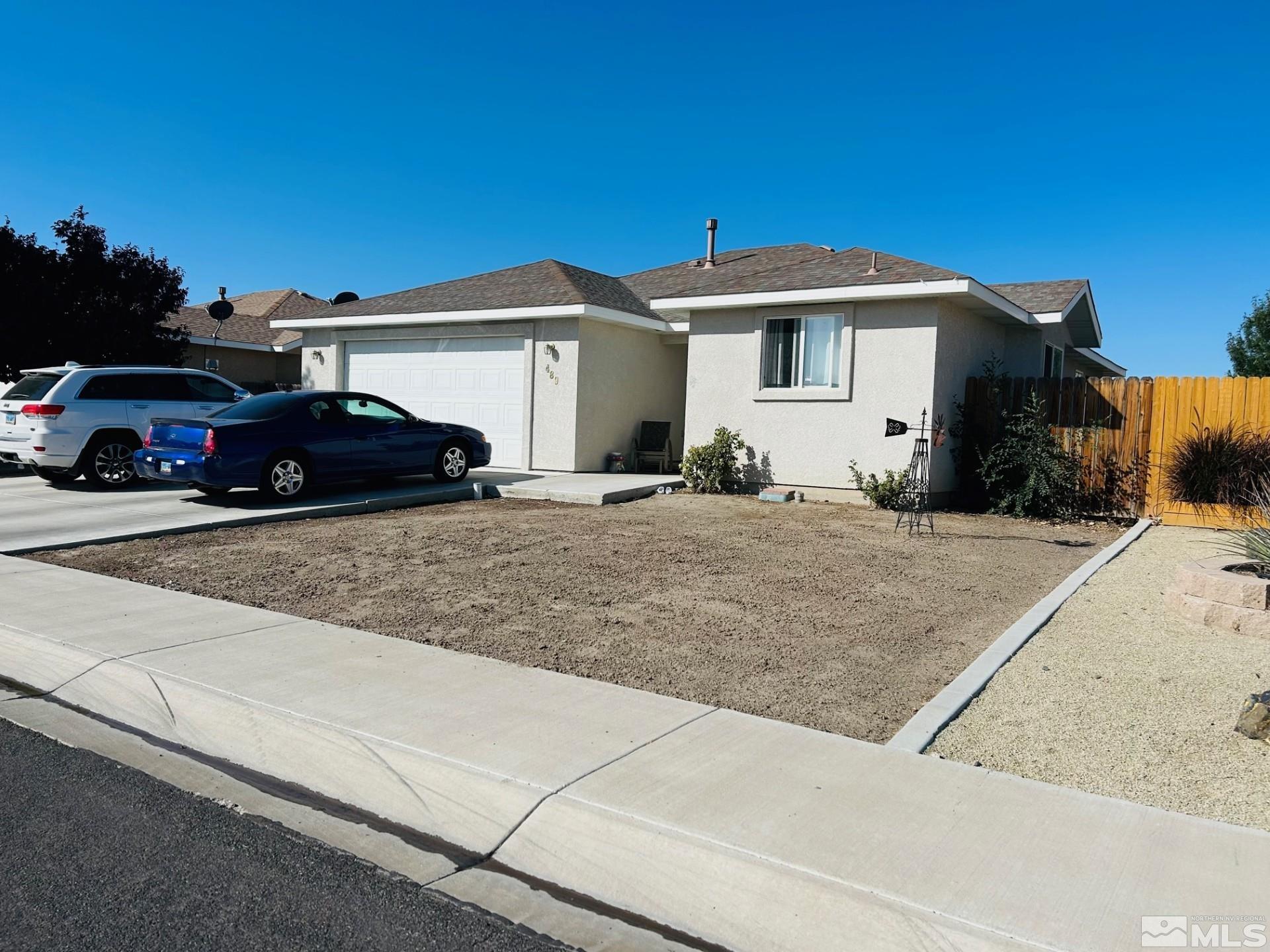 a car parked in front of a house