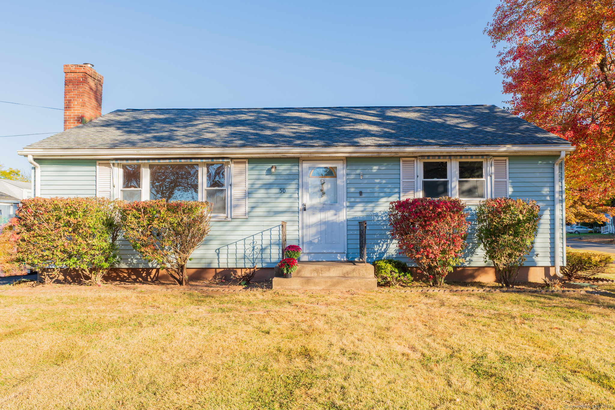 front view of a house with a yard