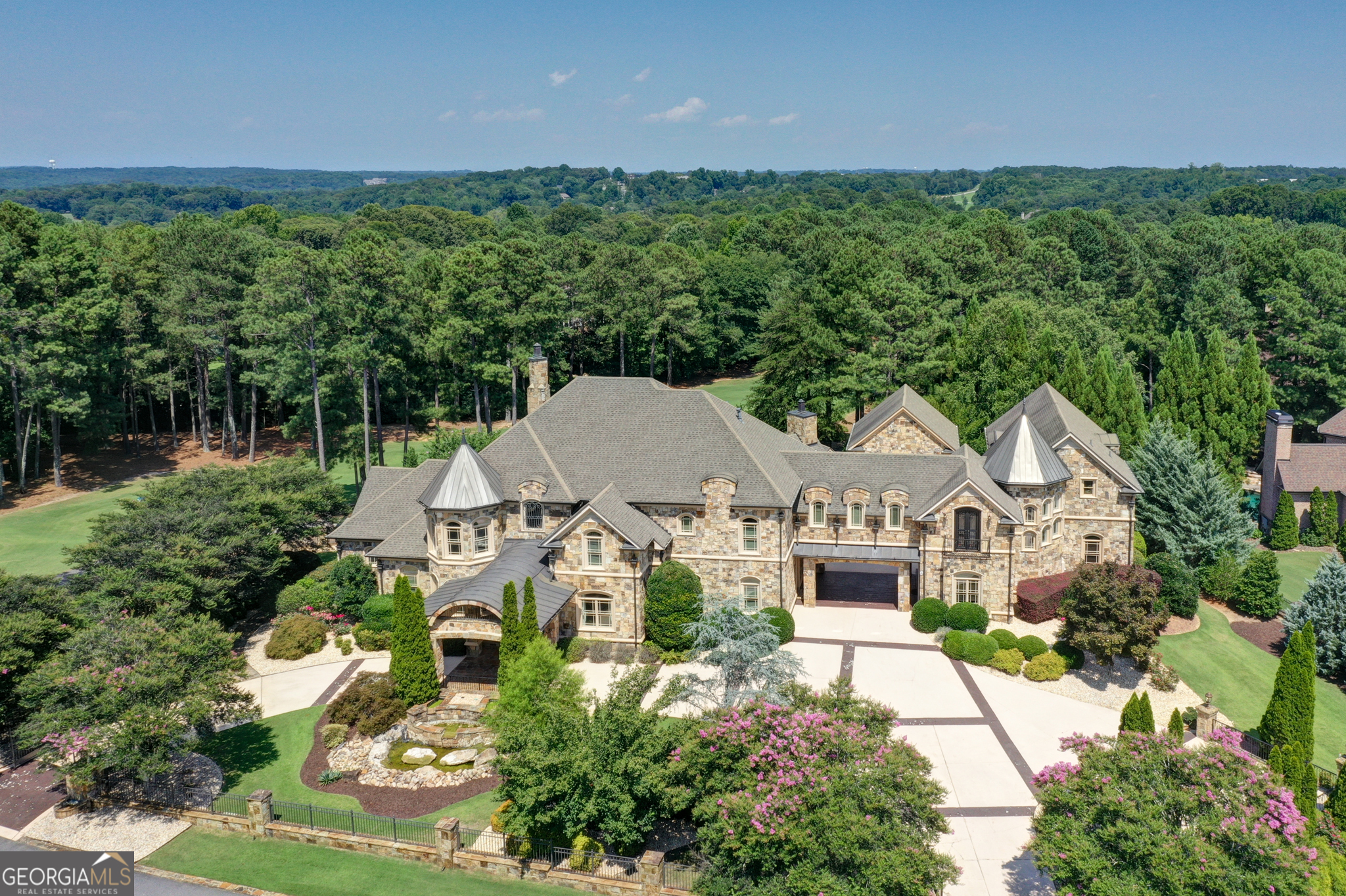 an aerial view of a house with a garden