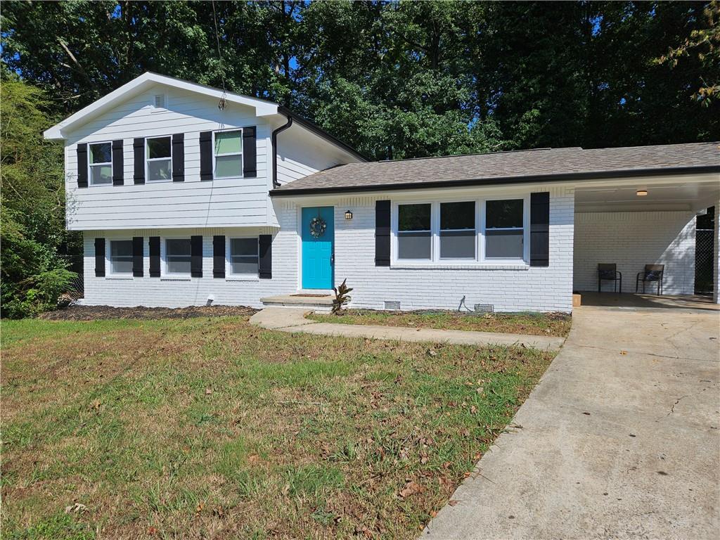 a front view of a house with a yard