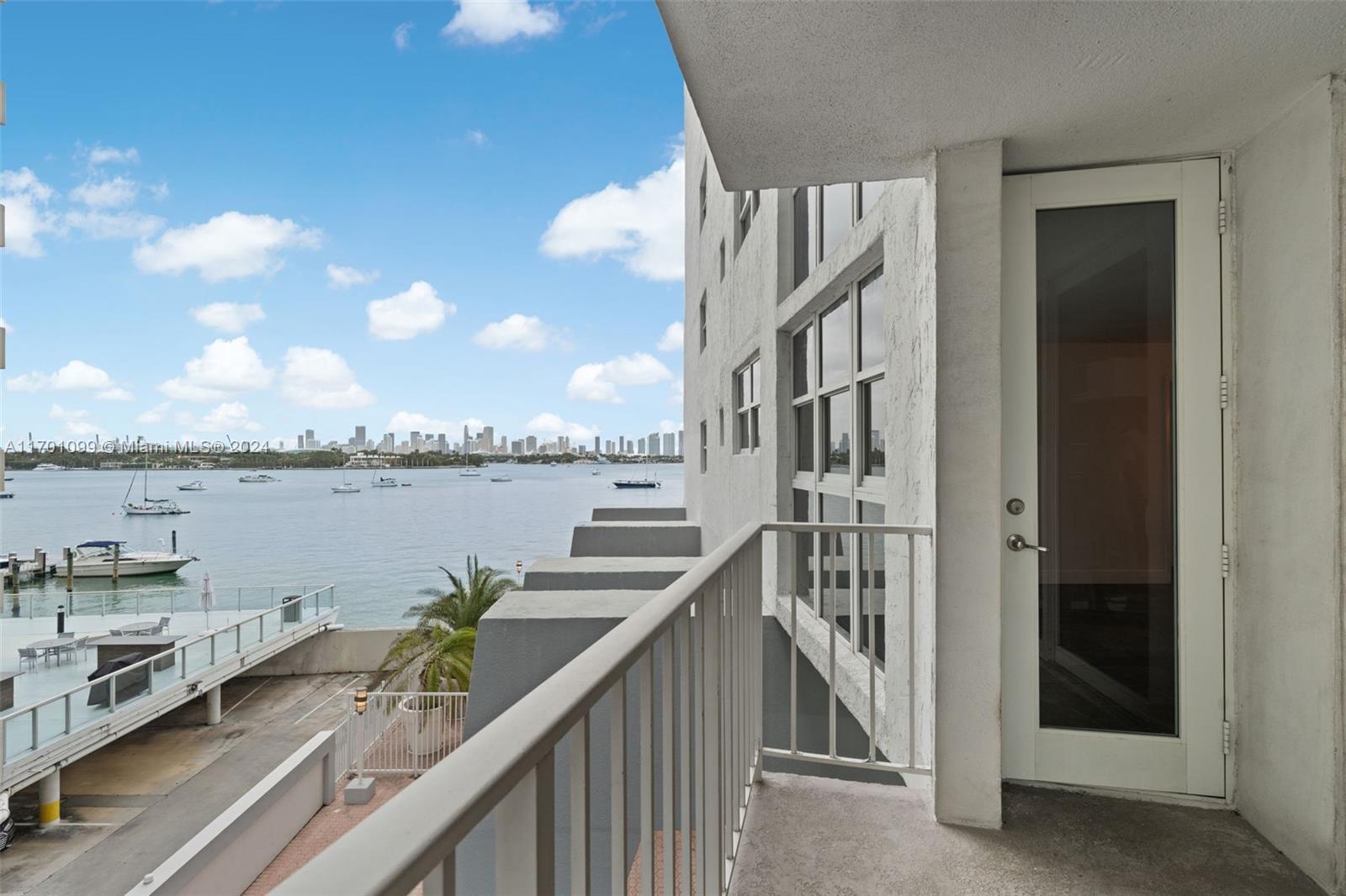 a balcony with city view and lake view