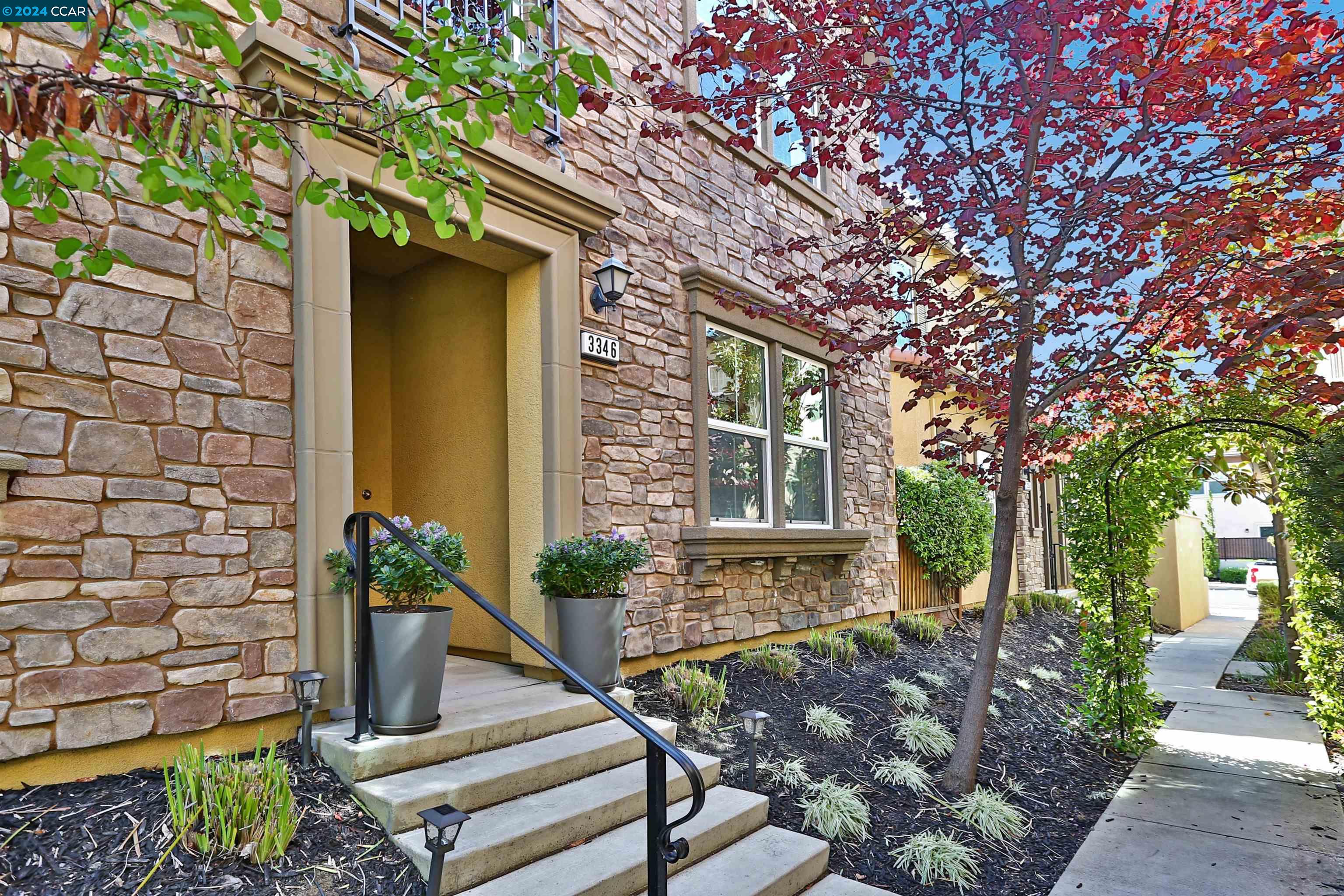 a front view of a house with garden