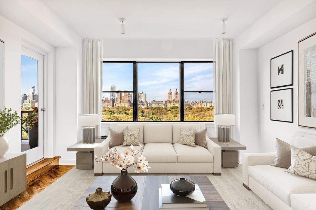 a living room with furniture and a large window with outer view