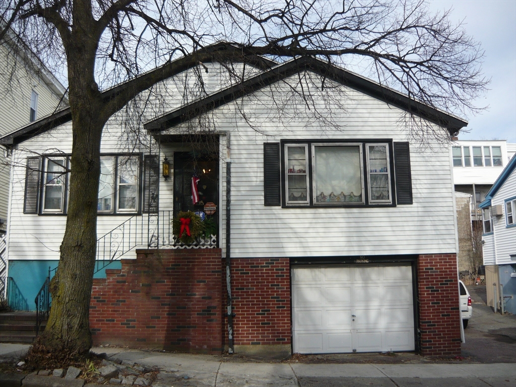 a front view of a house with glass windows