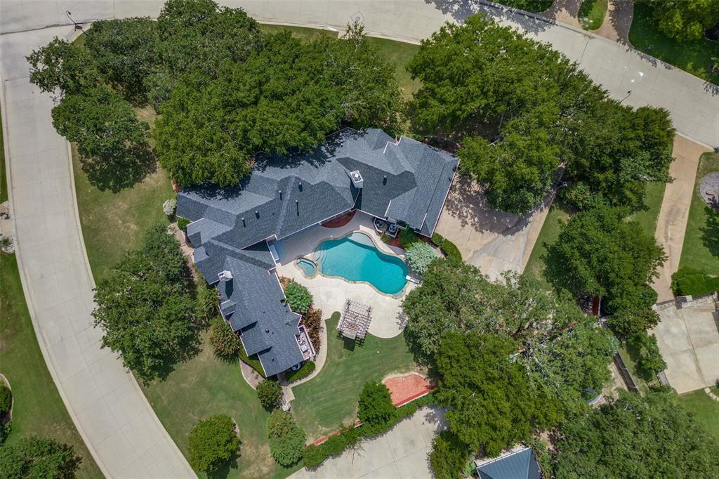 an aerial view of a house with an outdoor space