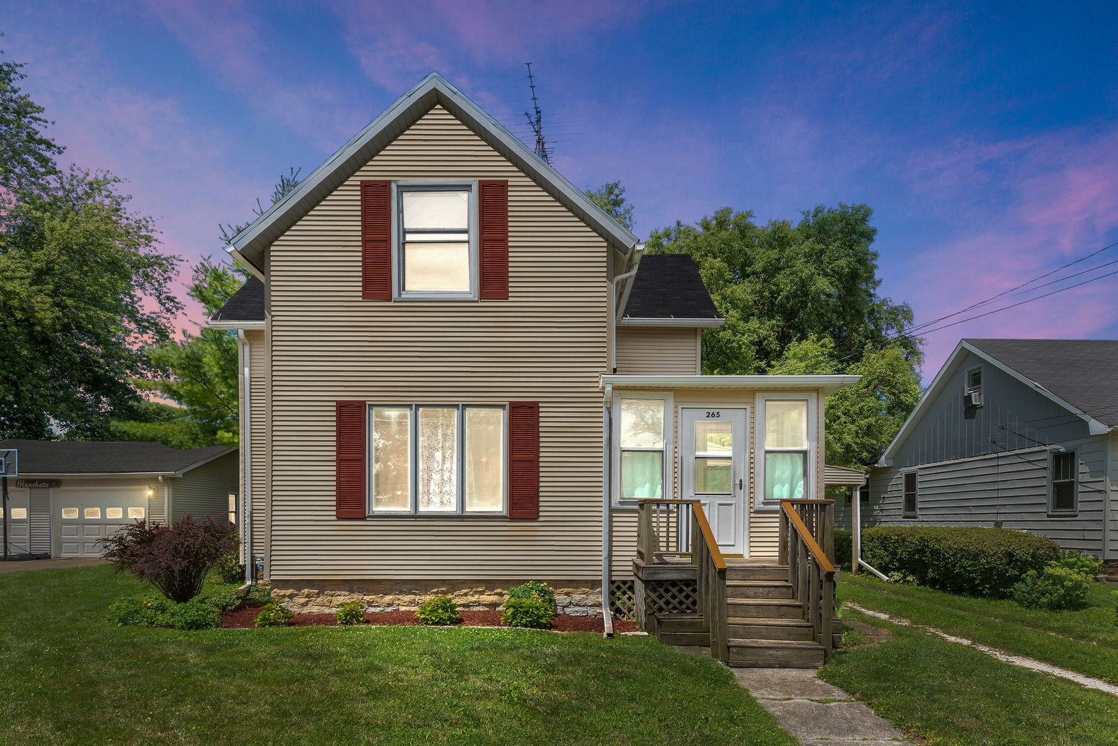 a front view of a house with a yard