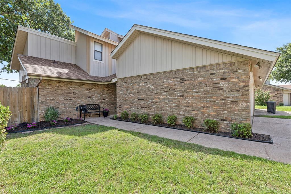 a view of a patio with a yard