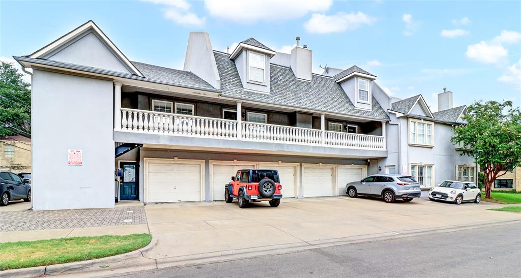 a view of a car park in front of house