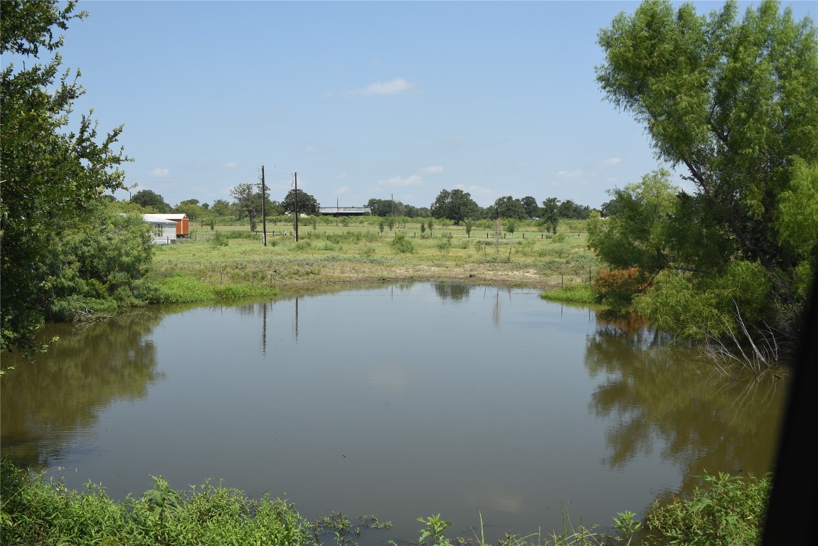 a view of lake with green space