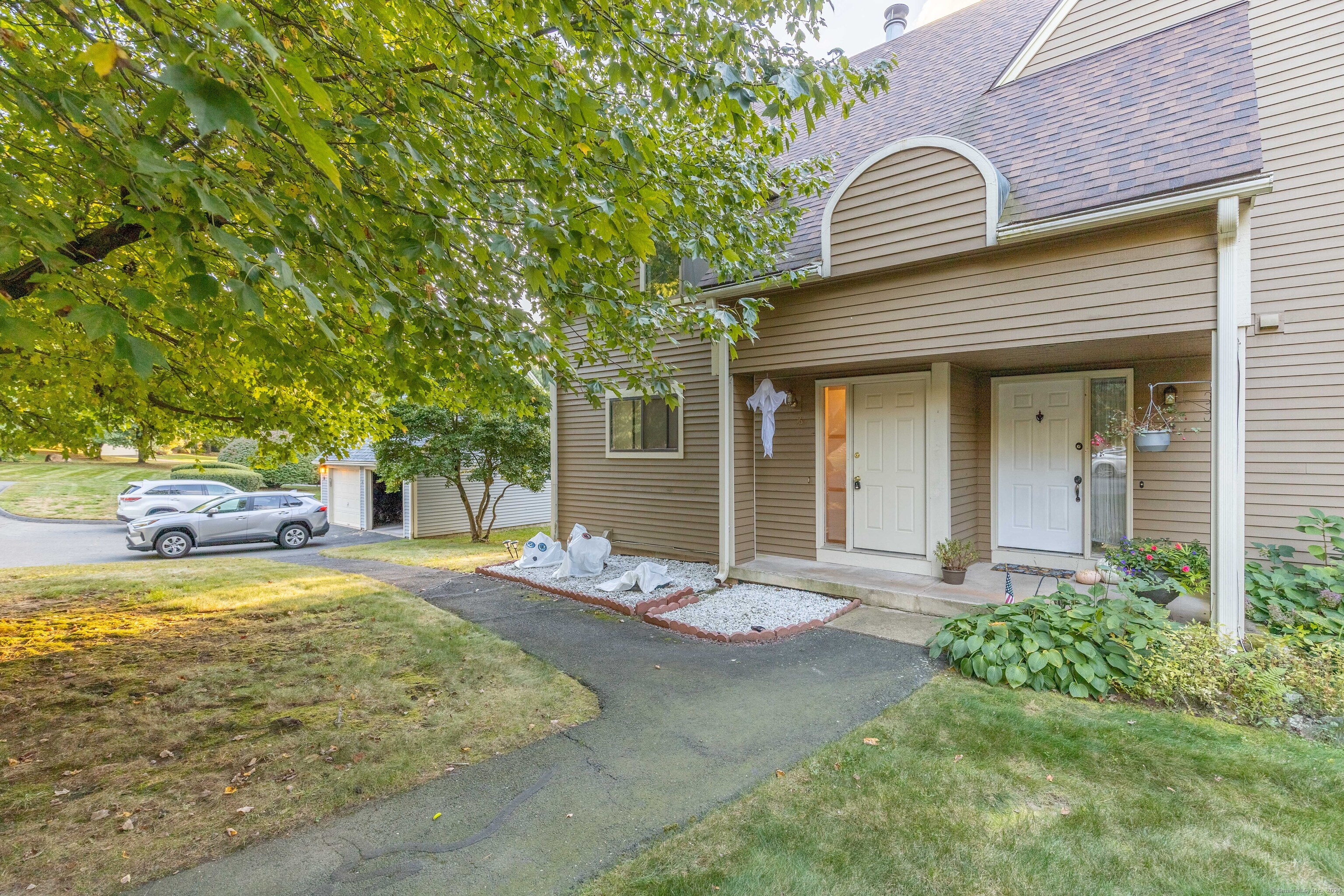 a front view of a house with garden