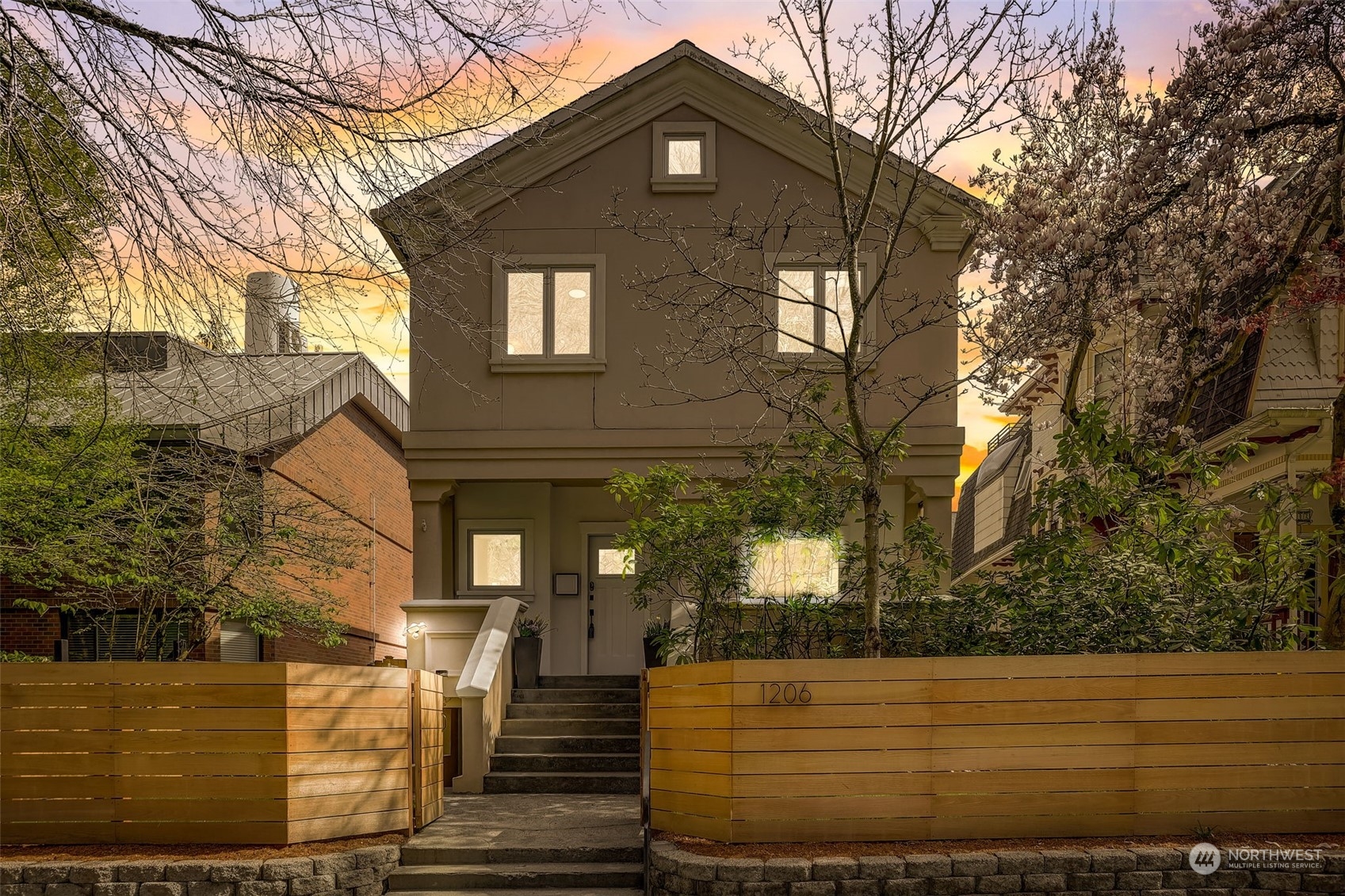 a front view of a house with trees