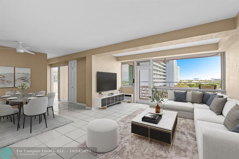 a living room with furniture a flat screen tv and a large window