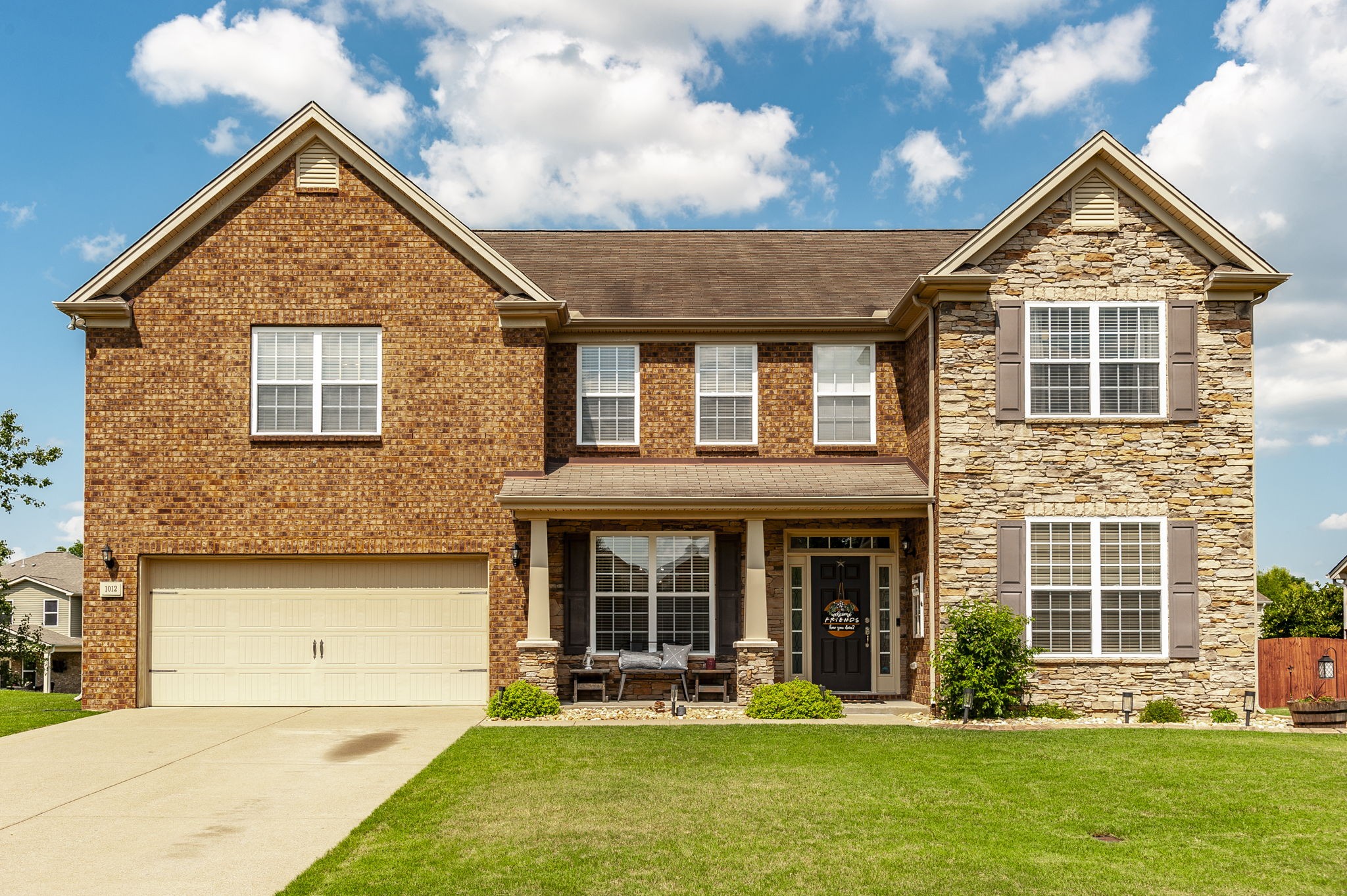 front view of a house with a yard