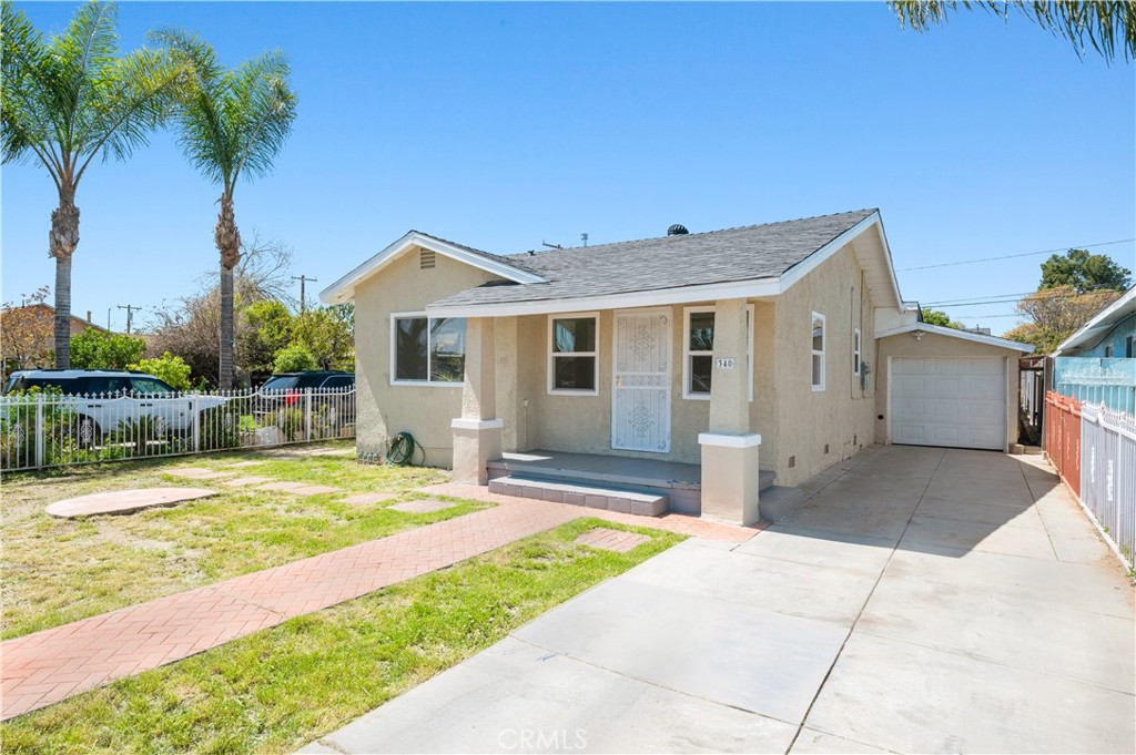 a house with palm tree in front of it