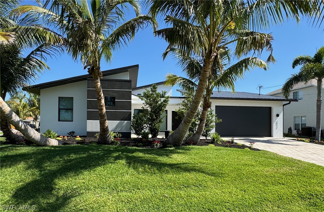 a front view of house with yard and green space