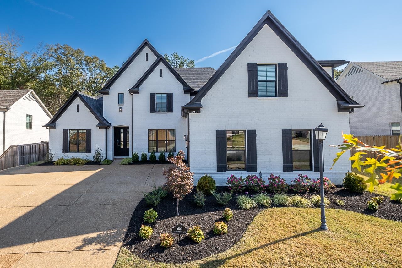 a front view of house with yard outdoor seating and entertaining space