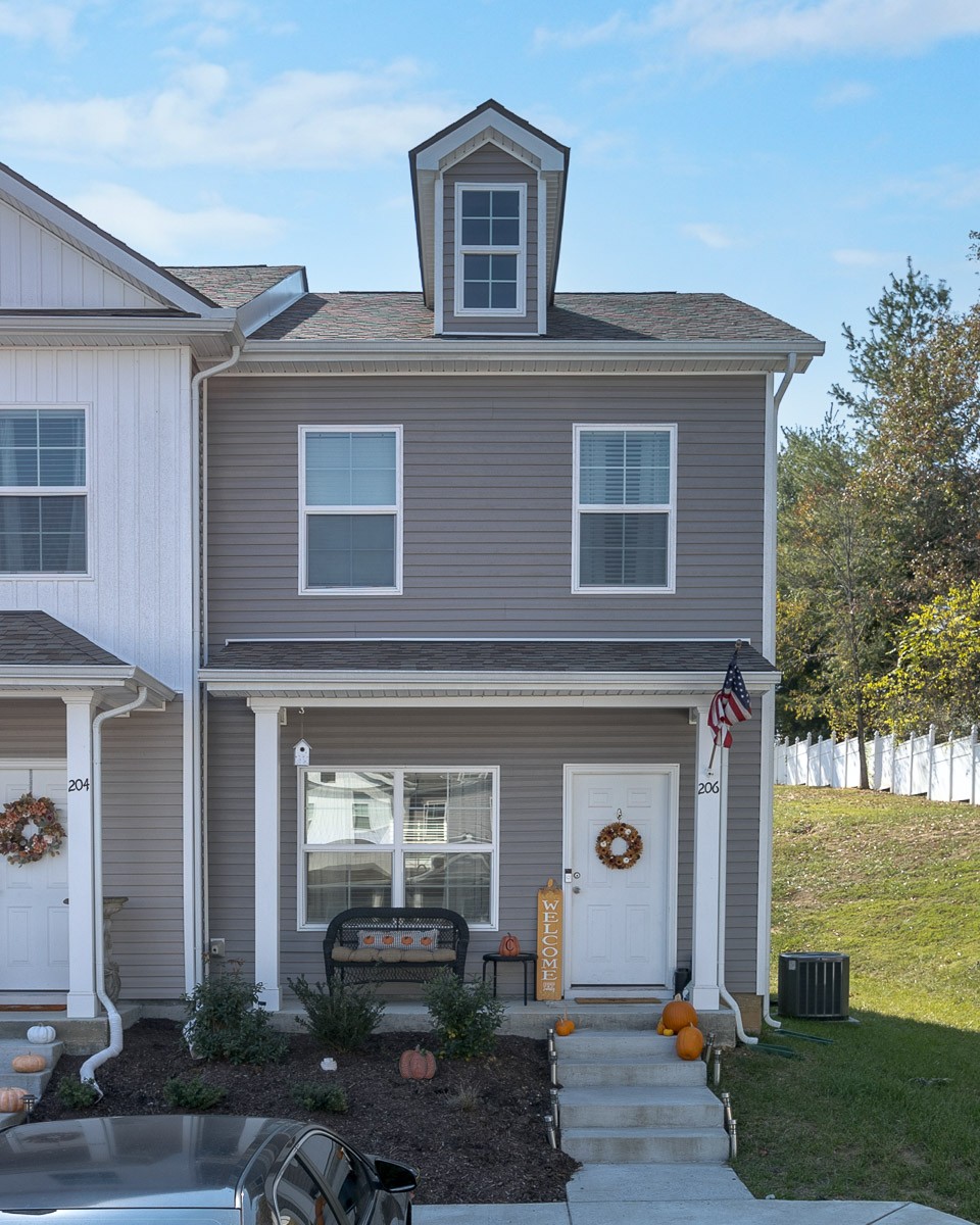 a front view of a house with garden