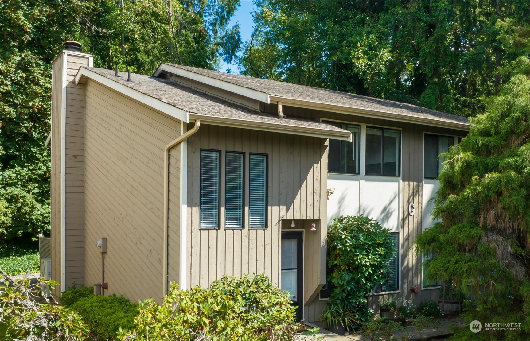 a view of the house with a small yard