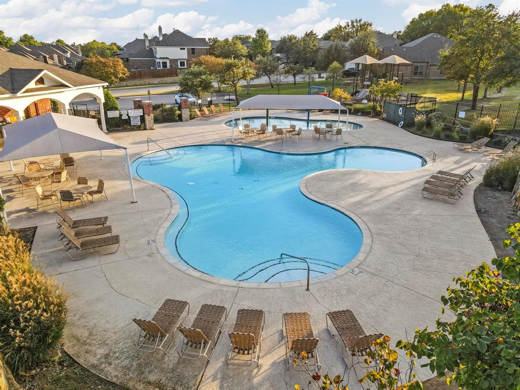 a view of a swimming pool with a lake view