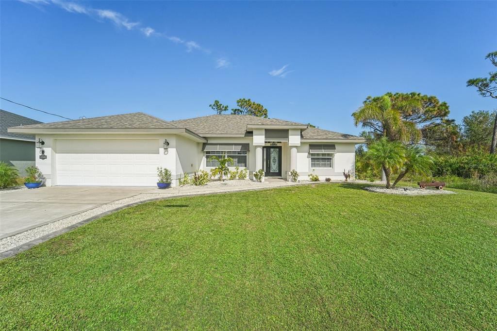 a front view of a house with a yard