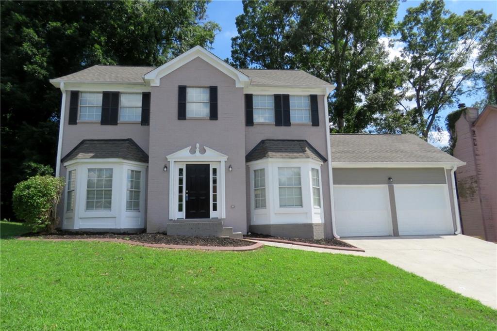 front view of a house with a yard