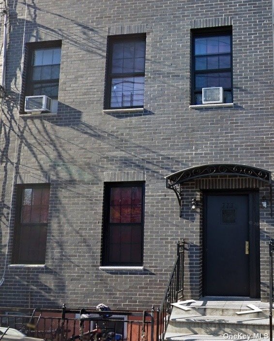 a brick house with four windows