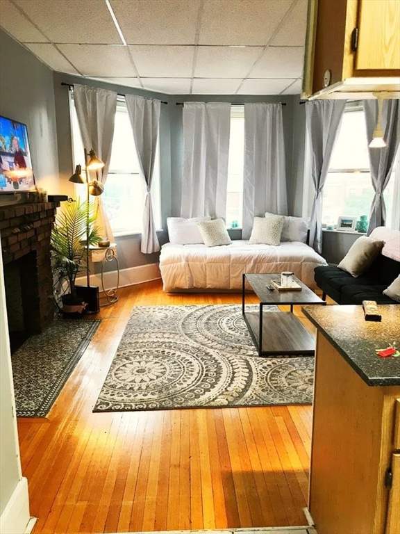 a living room with furniture rug and window