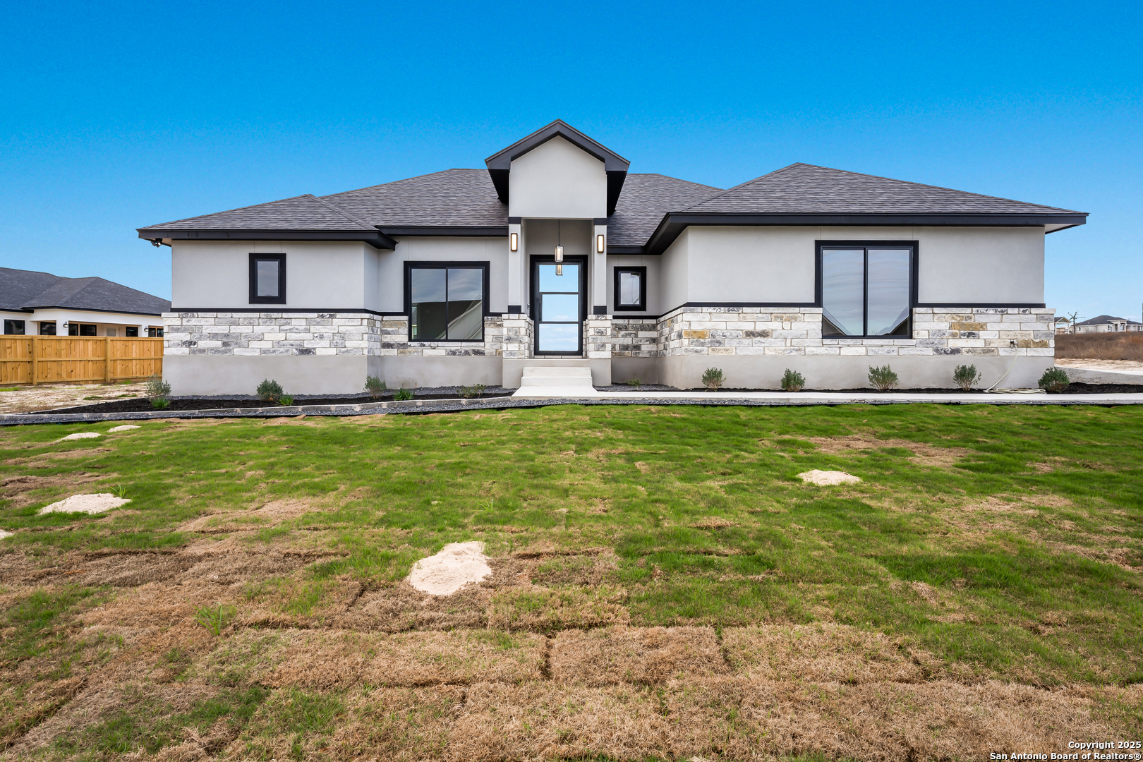 a front view of a house with a yard