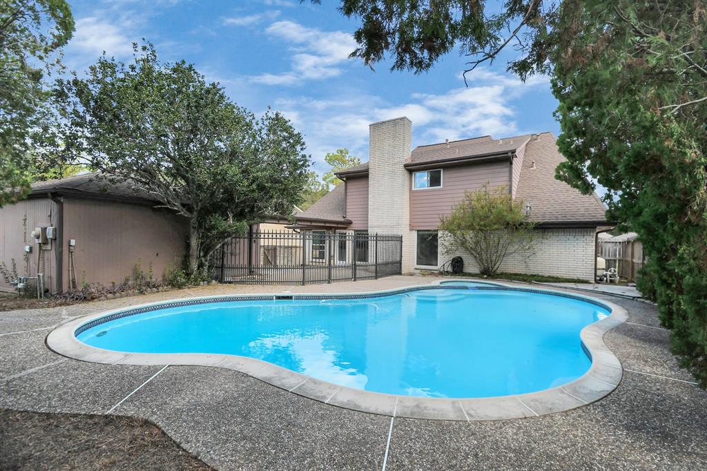 a view of a house with swimming pool