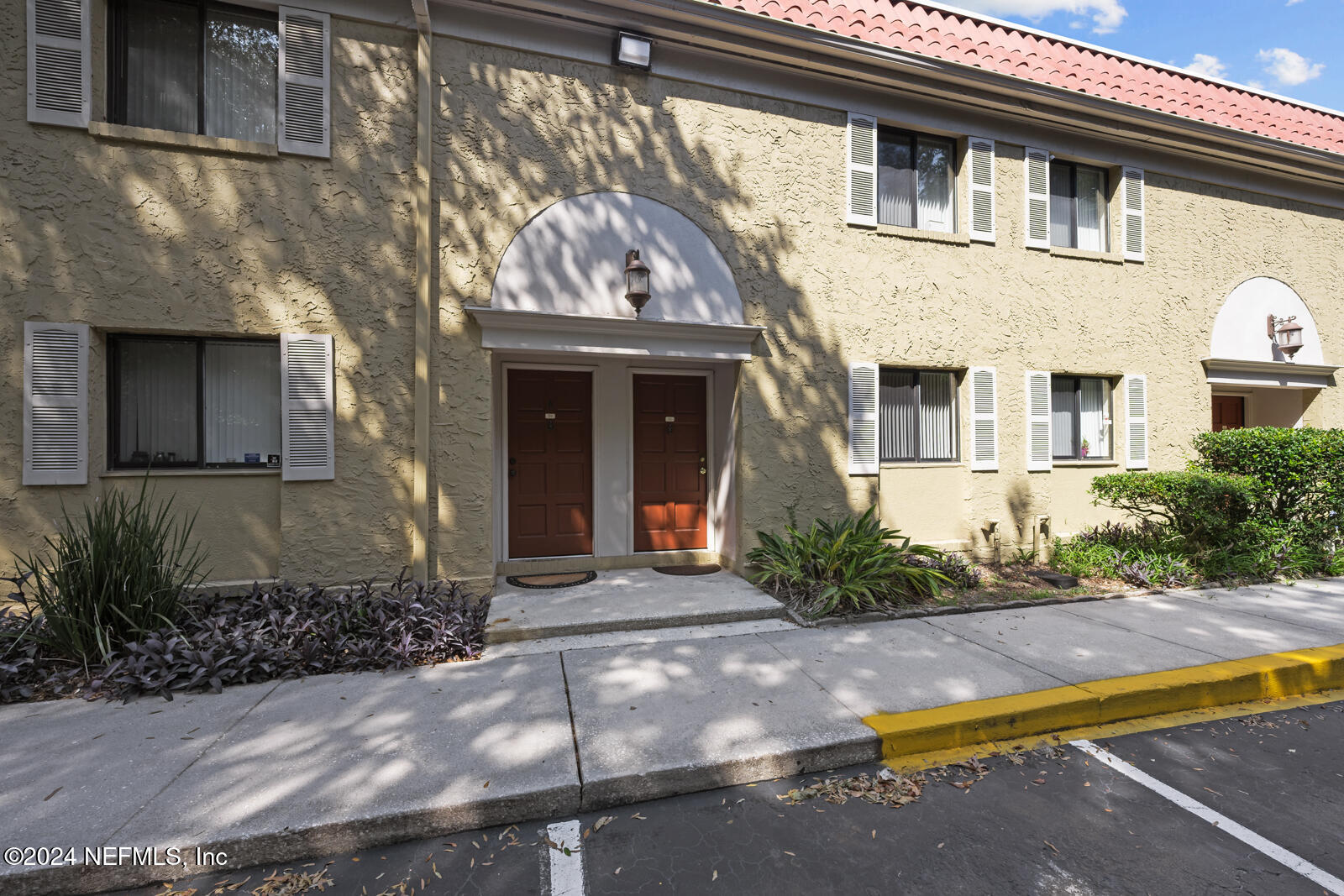 a front view of a house with garden