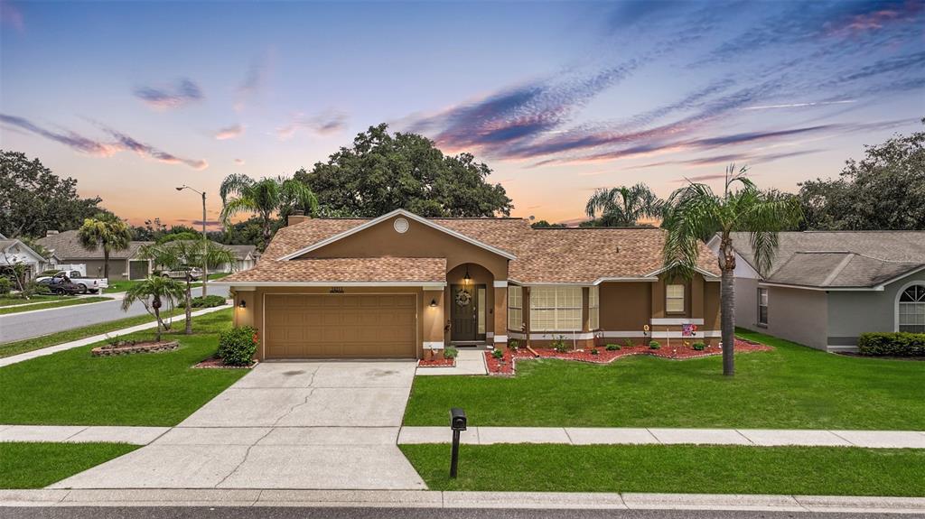 a front view of a house with a yard