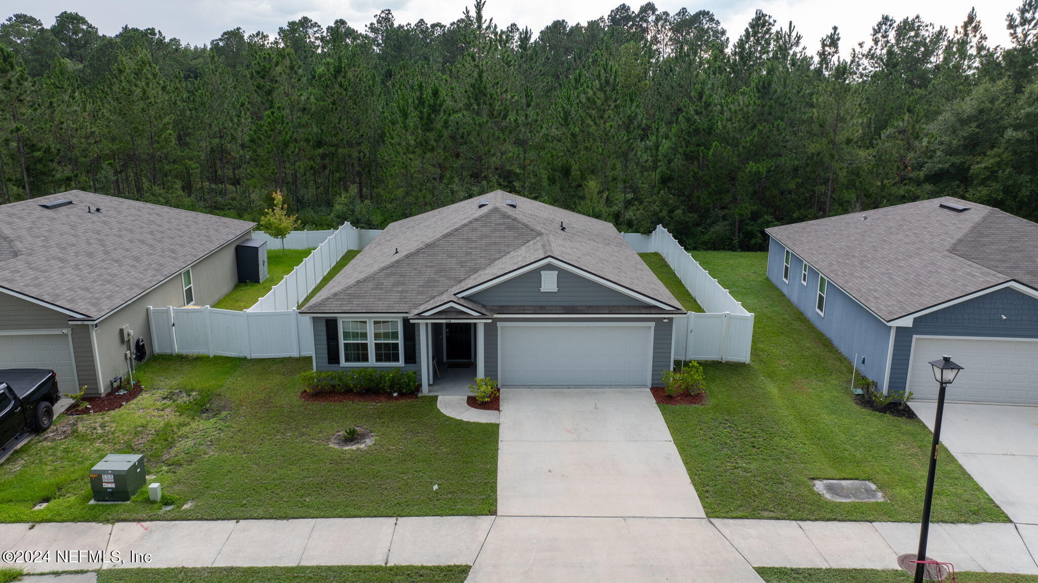 a aerial view of a house with a yard