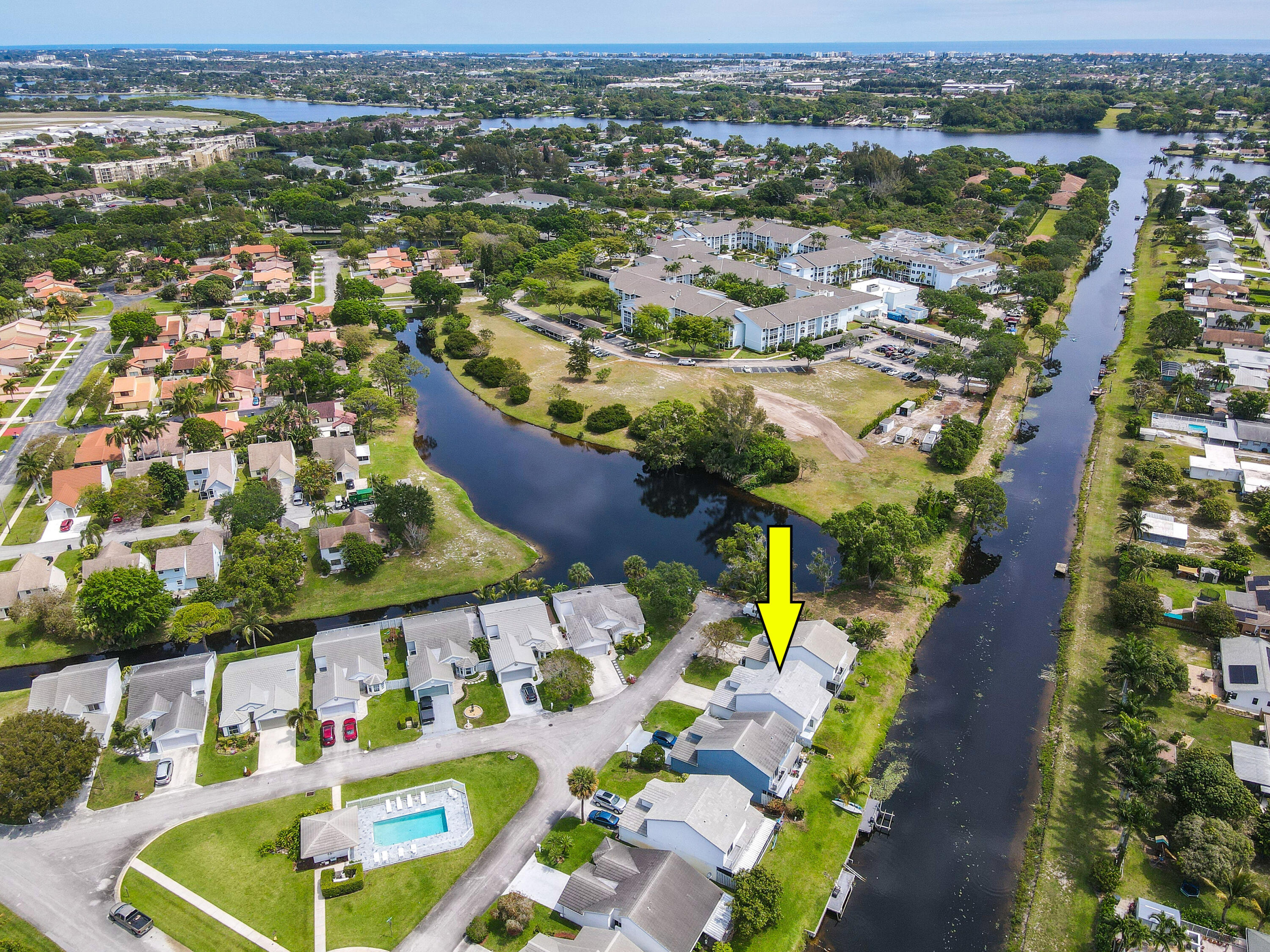 an aerial view of residential houses with outdoor space