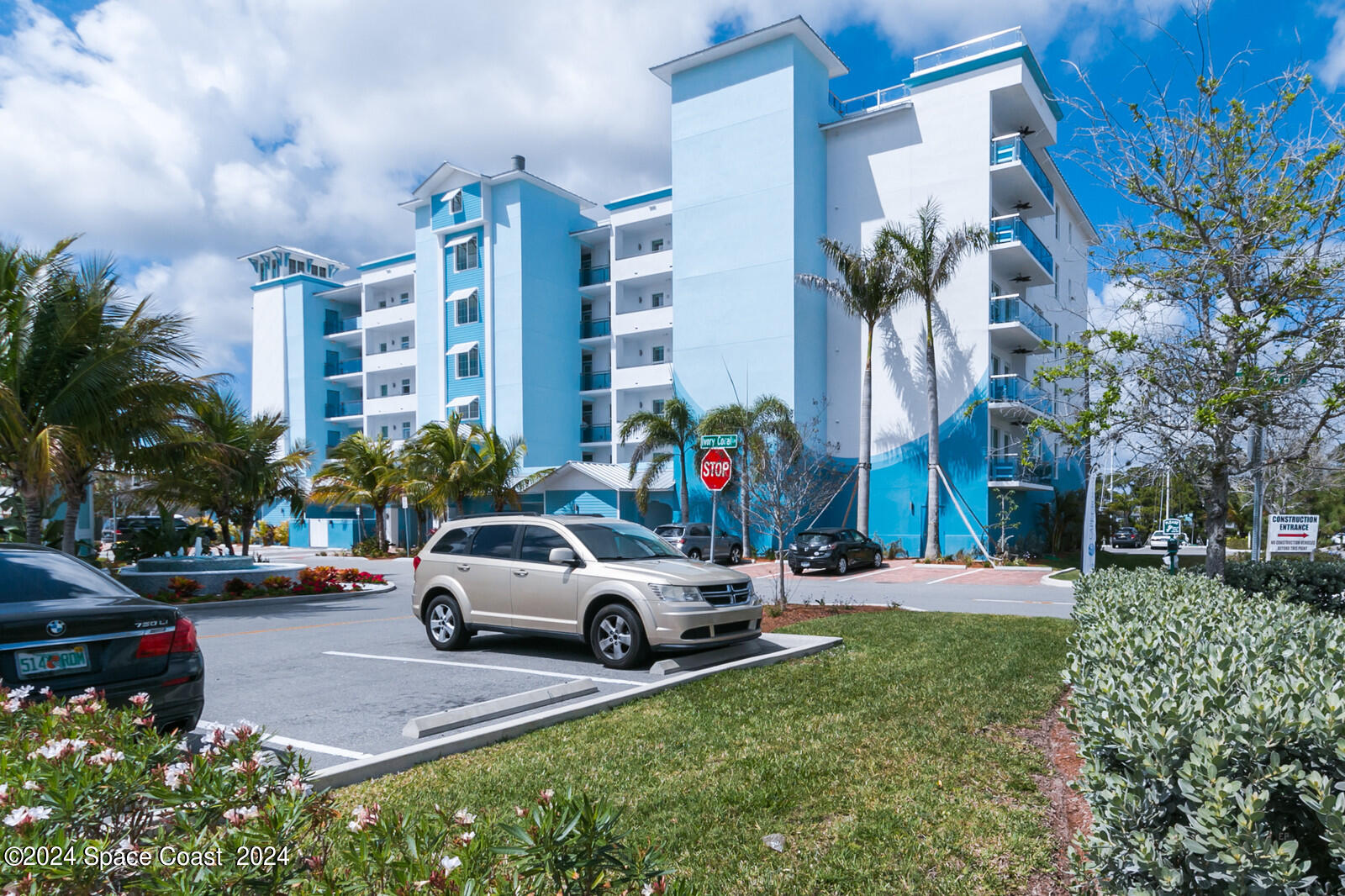 a view of a cars park in front of a building