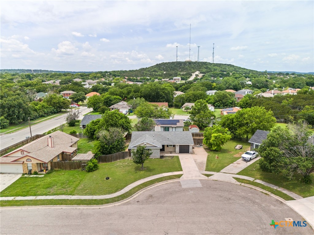 an aerial view of a house with outdoor space and street view