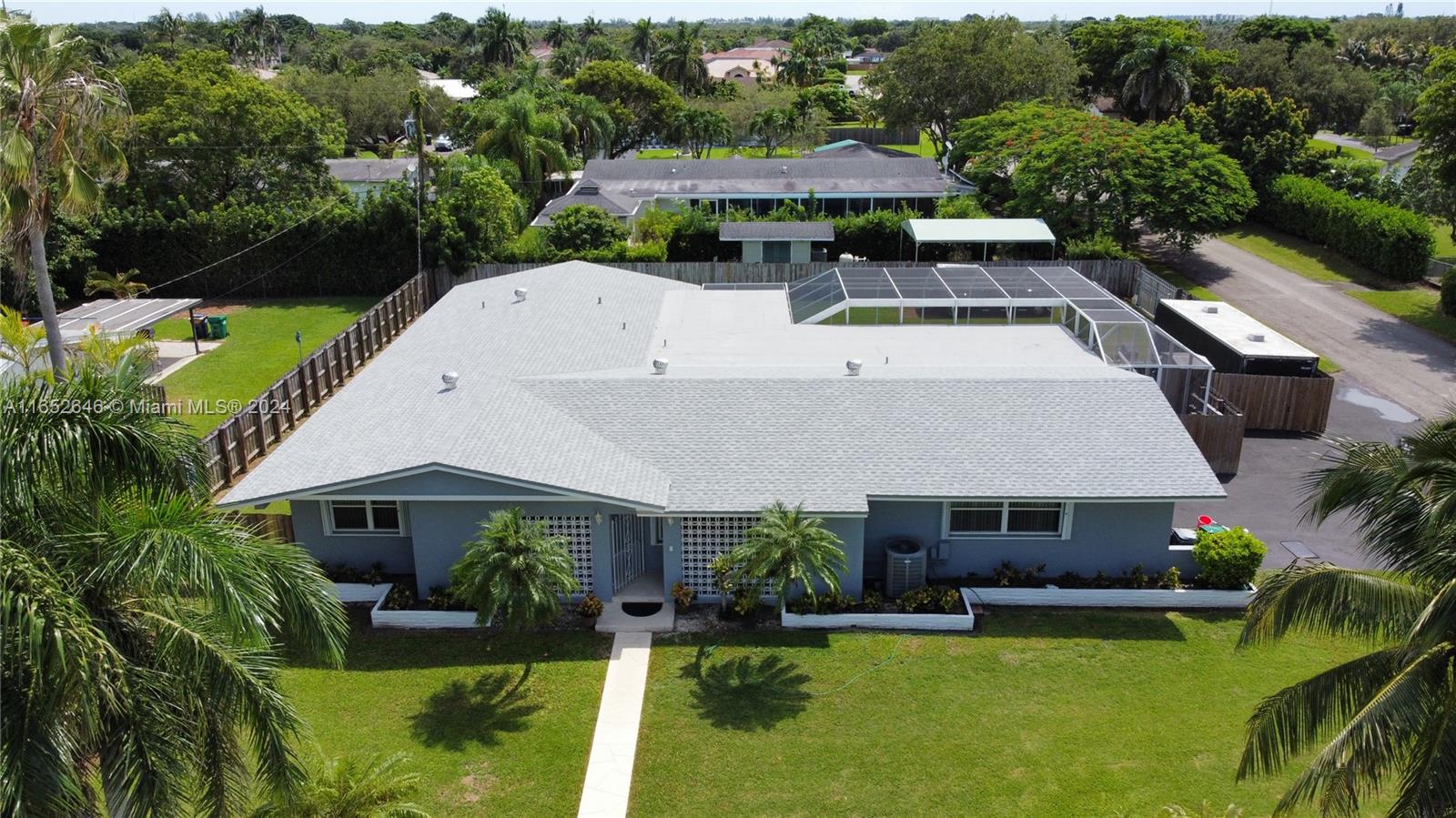 an aerial view of house with yard swimming pool and outdoor seating