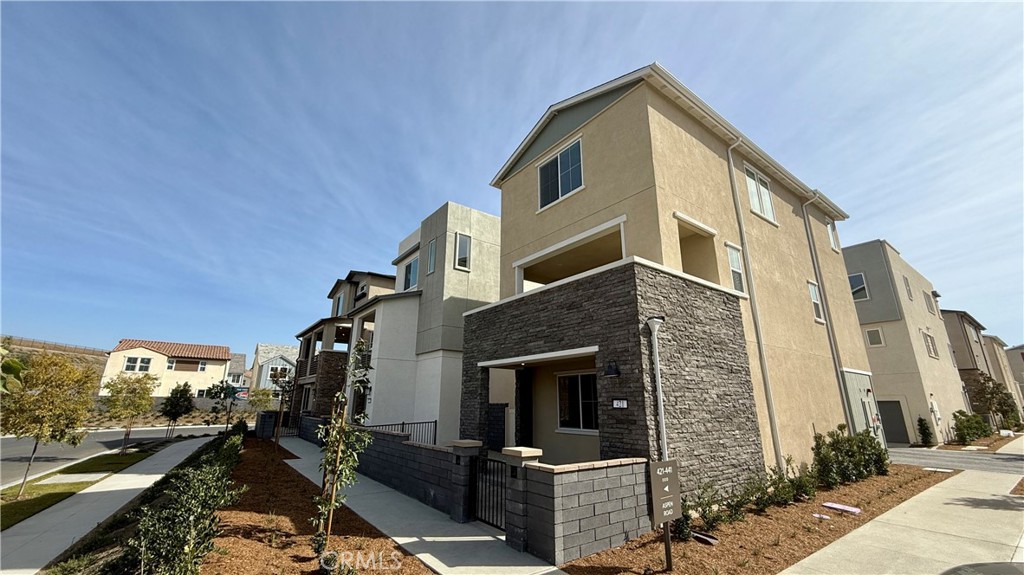 a front view of a house with parking area