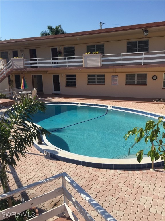 a view of a pool with a yard