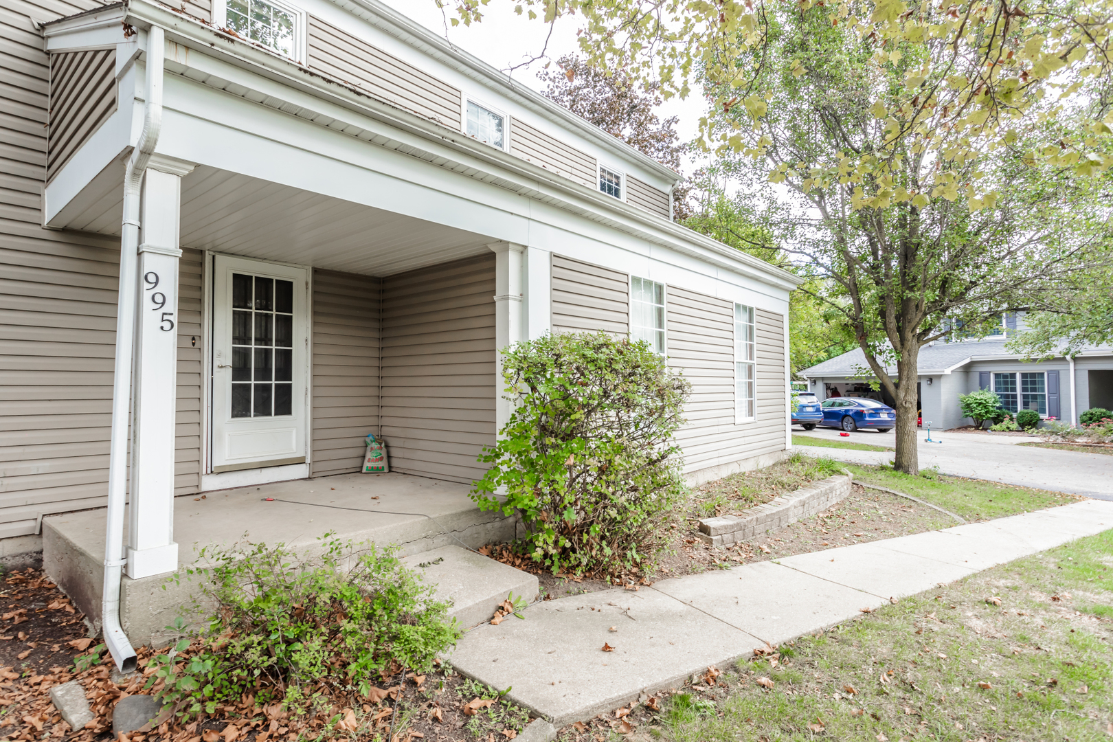 a view of a house with a yard and plants