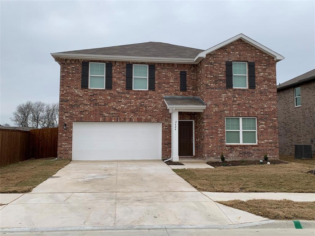 a front view of a house with yard