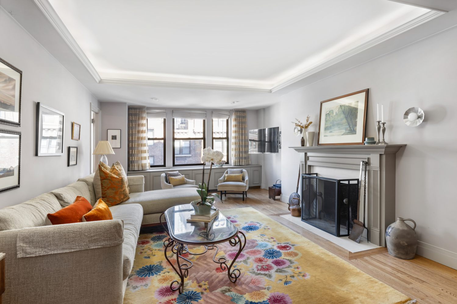 a living room with furniture fireplace and window