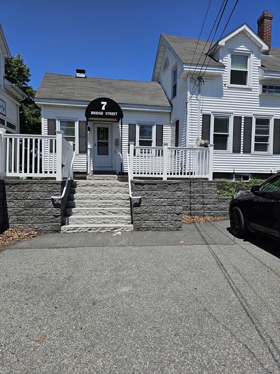 a front view of a house with yard