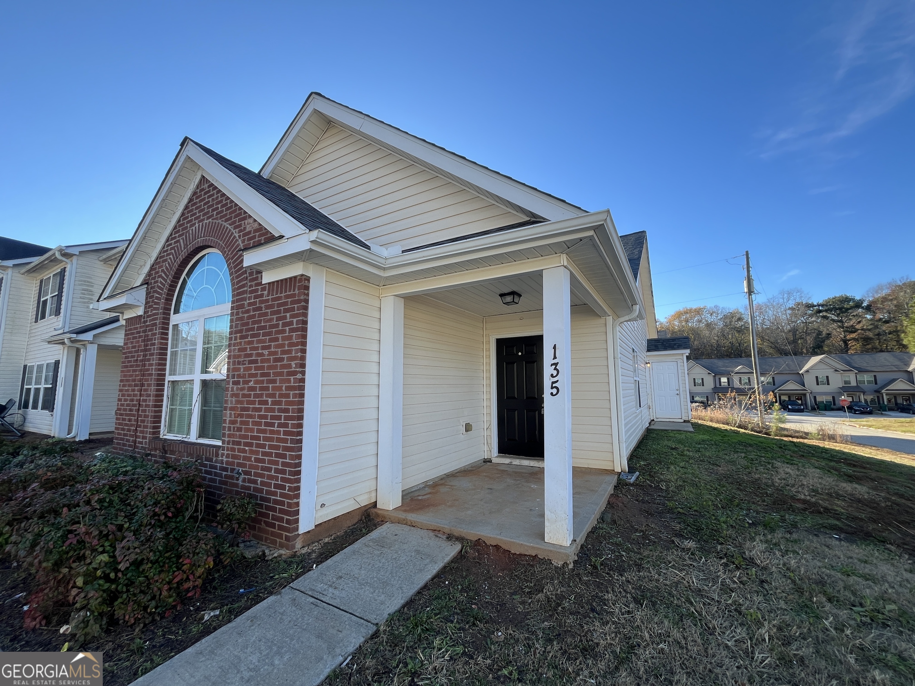 a front view of a house with a yard