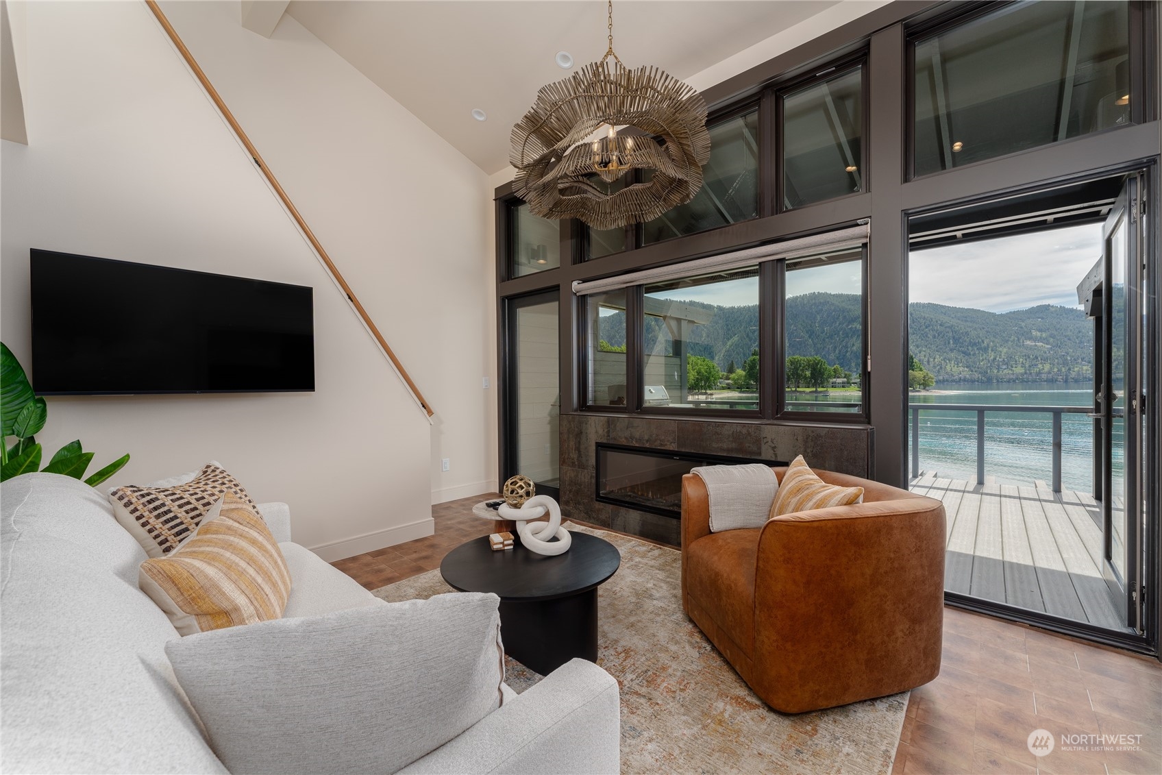 a living room with furniture and a flat screen tv