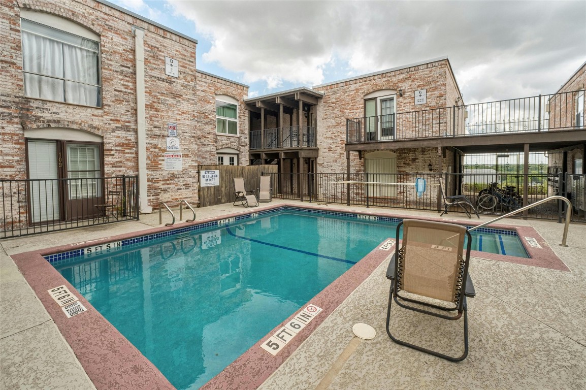 a swimming pool with outdoor seating